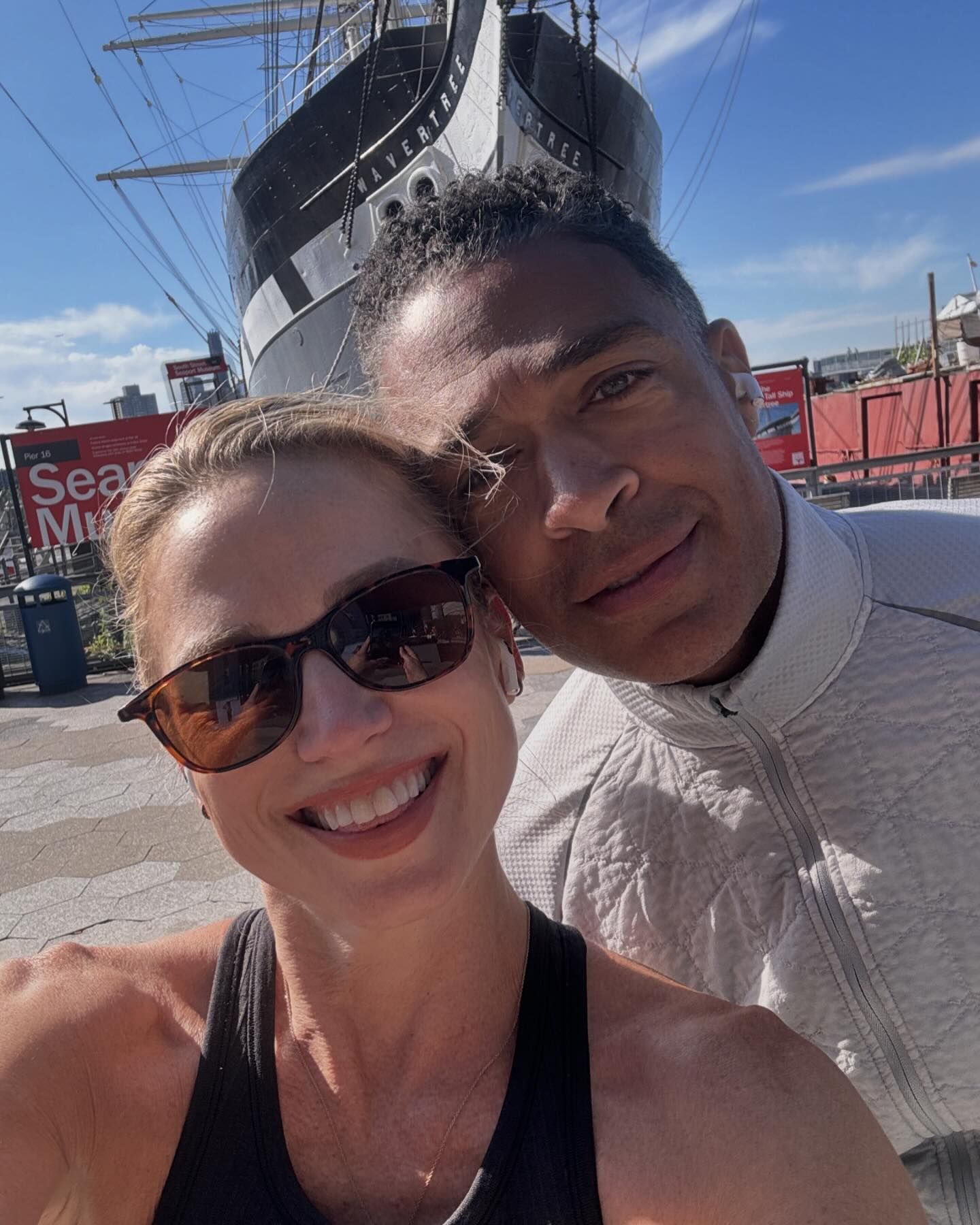 Amy Robach and TJ Holmes taking a selfie in front of the Wavertree ship.