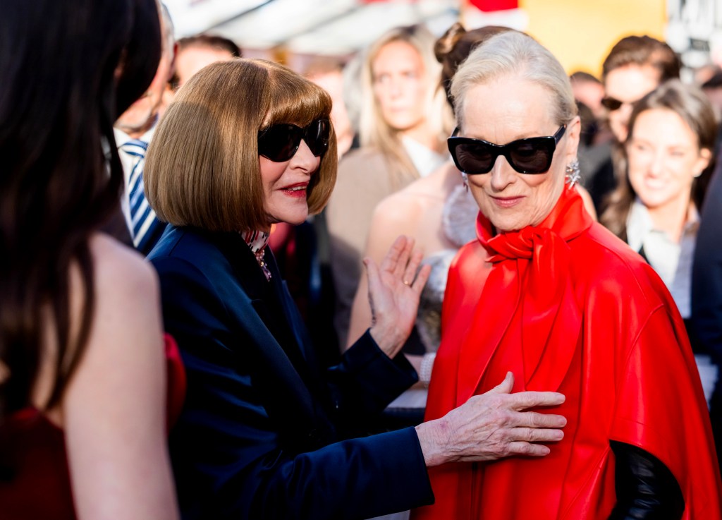 Anna Wintou, in a black coat,r and Meryl Streep, in a red cloak, at the world premiere of "The Devil Wears Prada 2."