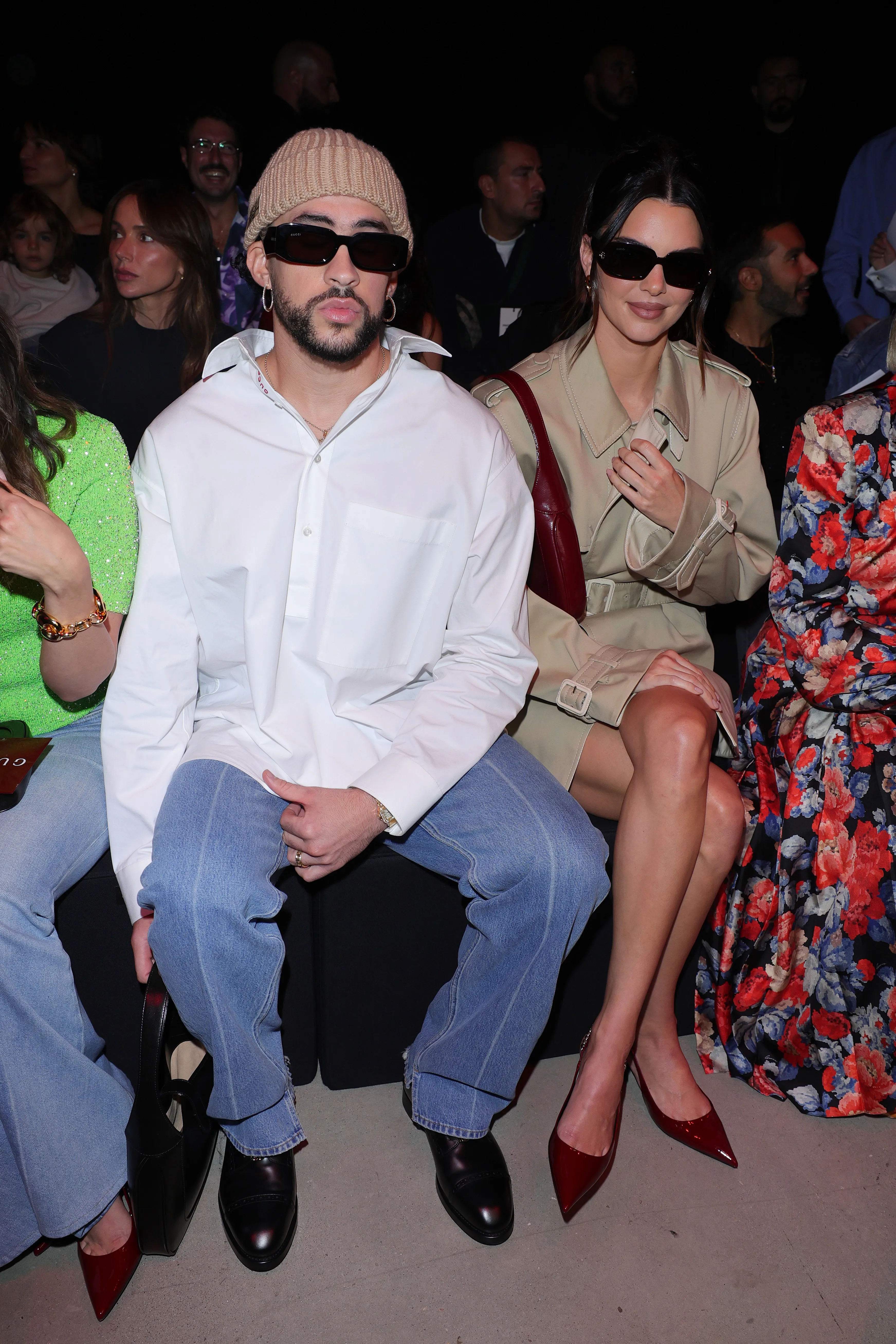 Bad Bunny and Kendall Jenner sitting at a Milan Fashion Week event.
