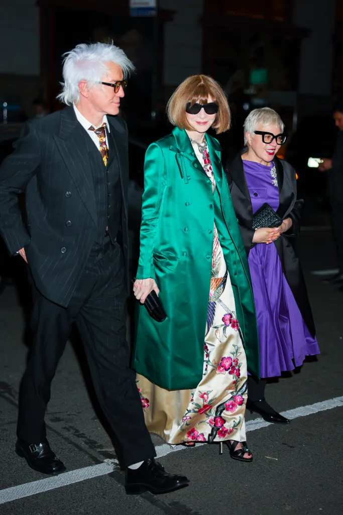 Baz Luhrmann, Anna Wintour, and another person attend the Met Gala pre-party.