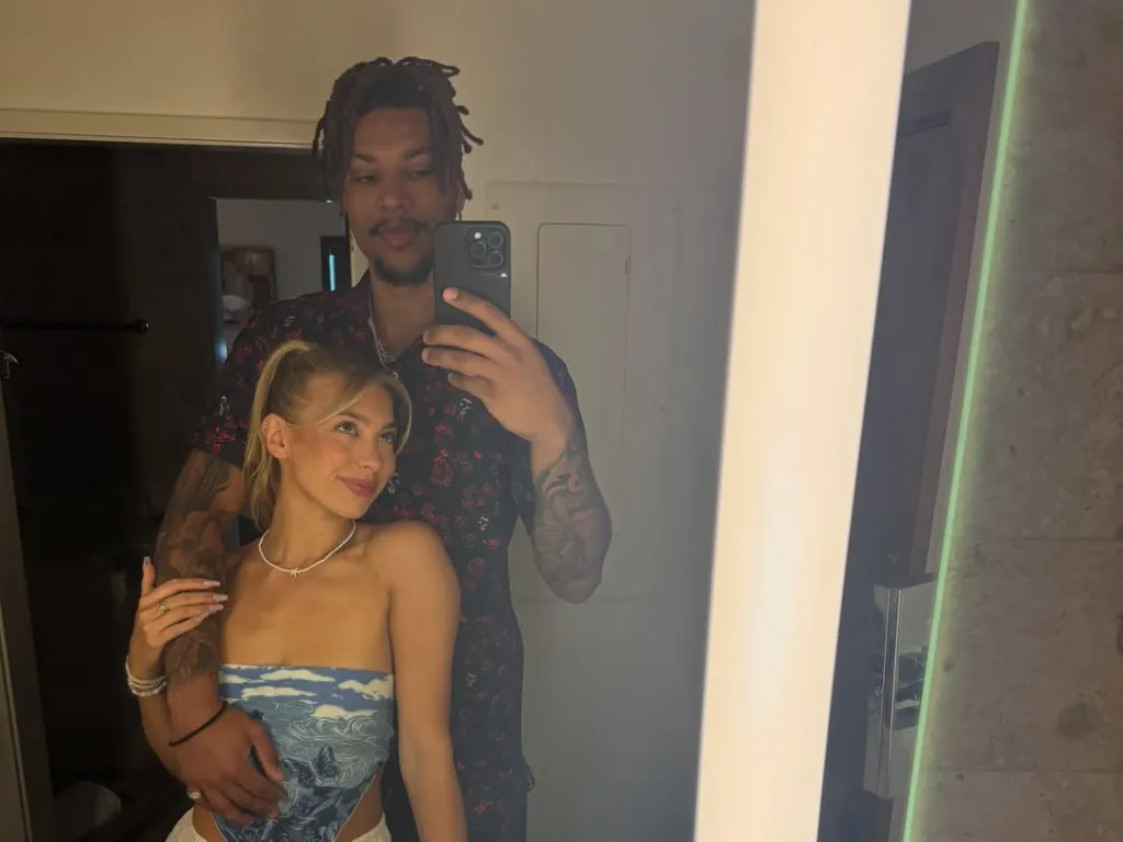 Brandon Clarke taking a mirror selfie with Amber Lorraine.