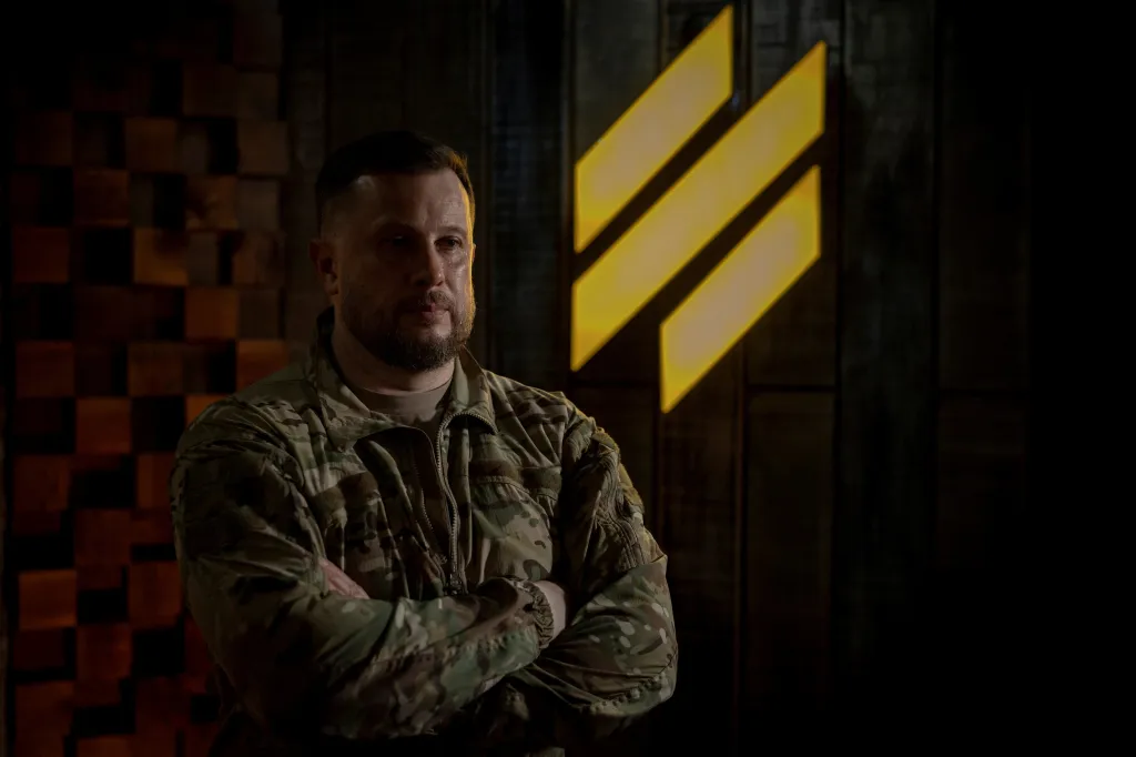 Brigadier General Andriy Biletsky of the Ukrainian Armed Forces in uniform with arms crossed.