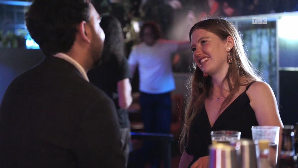 Catie smiles at Josh.