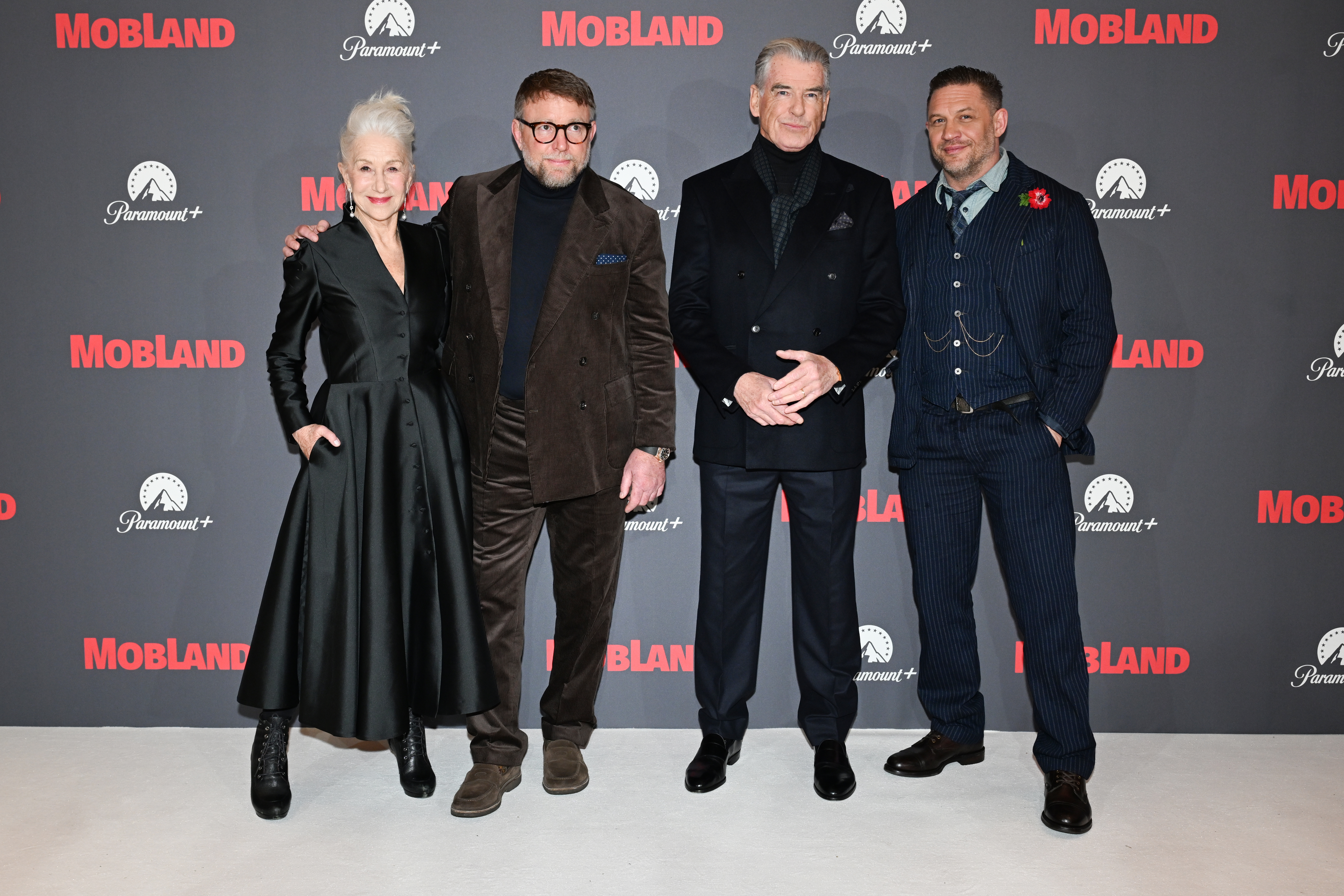 Helen Mirren, Guy Ritchie, Pierce Brosnan, and Tom Hardy at the premiere of "MobLand."