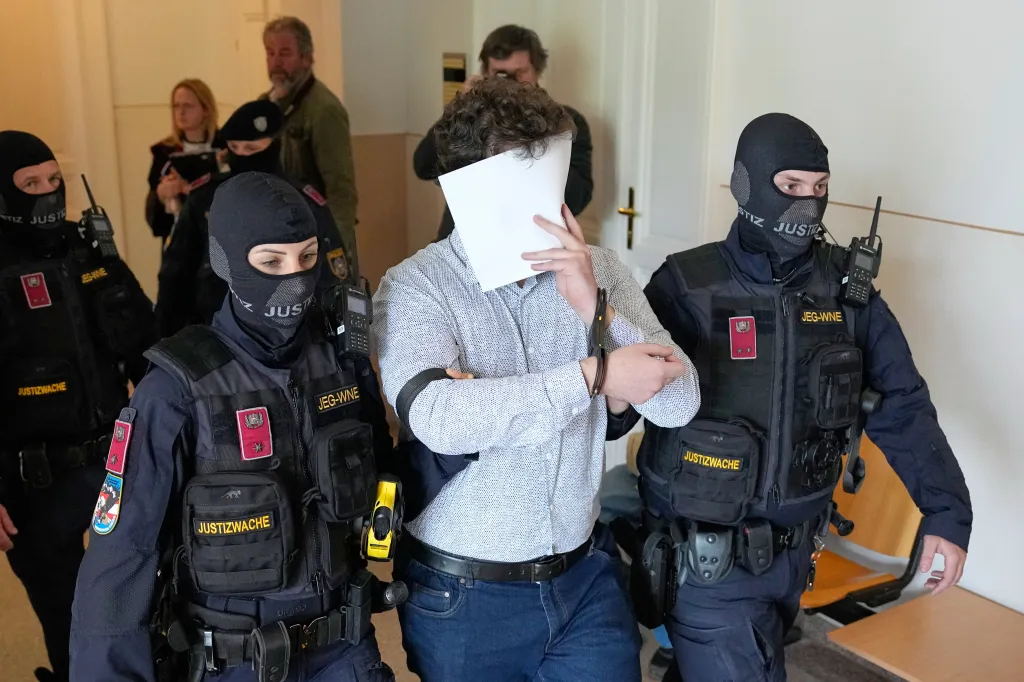 Defendant Beran A. wears a new shirt as he is returned to the courtroom in the District Court in Wiener Neustadt, Austria, where he stands trial for plotting to carry out an attack on one of superstar singer Taylor Swift's concerts in Vienna in August 2024 and pledging allegiance to the Islamic State group, Tuesday, April 28, 2026.