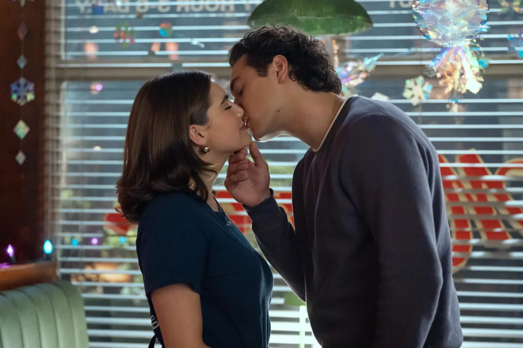 Ella Bright and Belmont Cameli kissing.