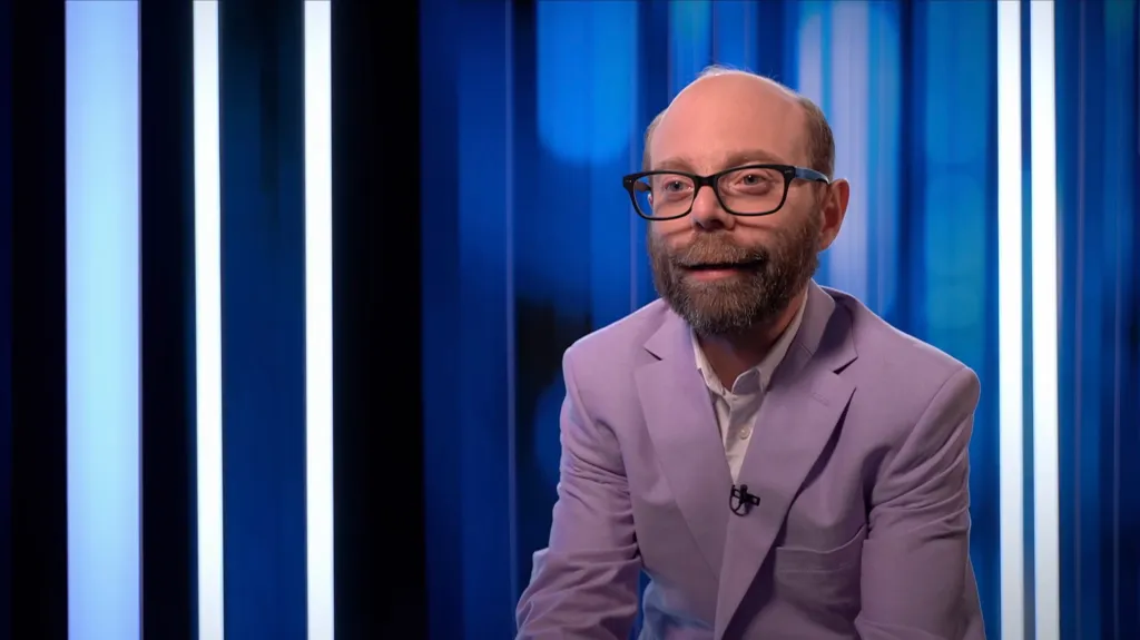 Steven Anthony Lawrence, known for playing Beans on "Even Stevens," wearing a lavender suit jacket.