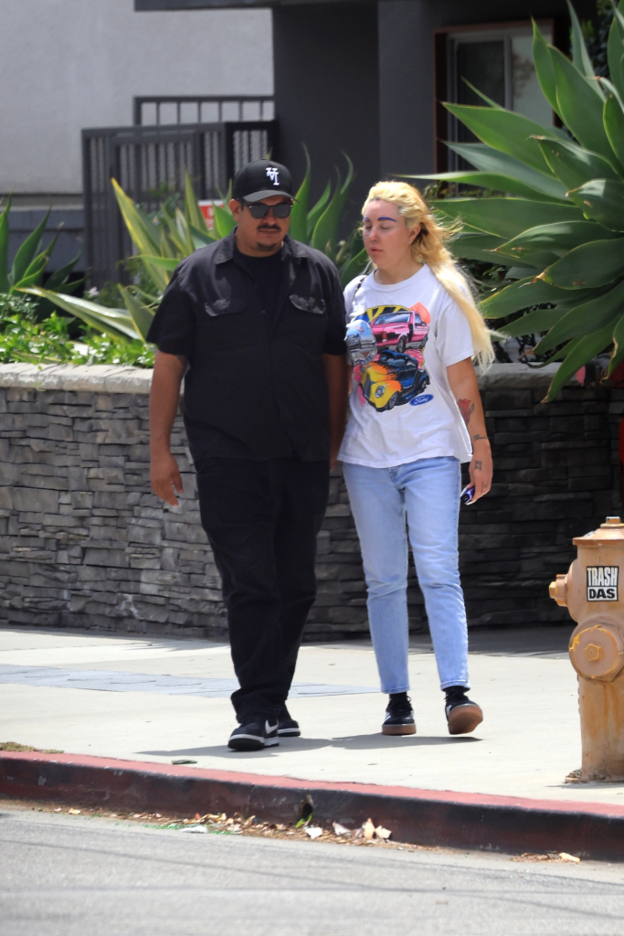 Amanda Bynes and Zachary Khan holding hands while walking in Los Angeles.