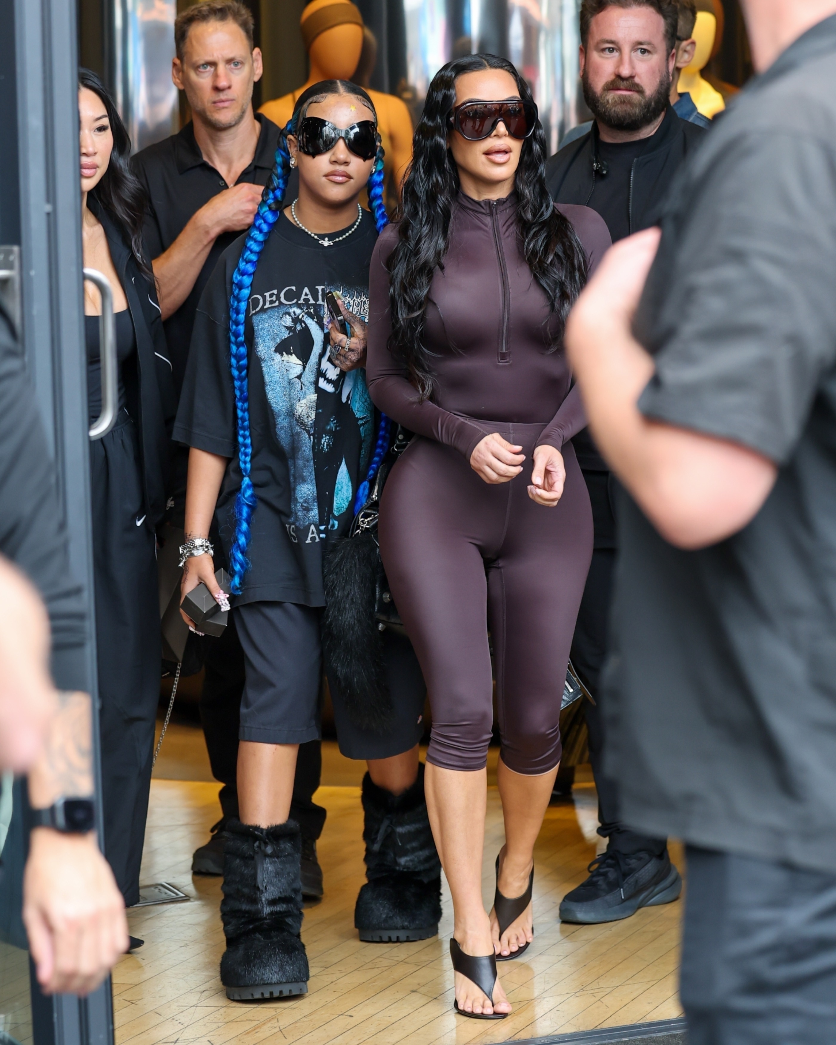 Kim Kardashian and North West leaving the NikeSKIMS store.