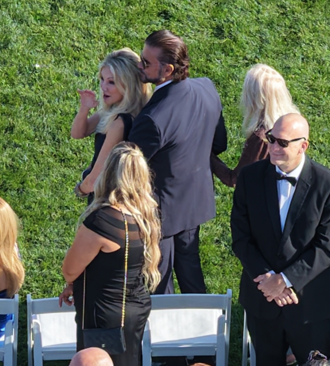 Heather Locklear and Lorenzo Lamas attending a wedding.