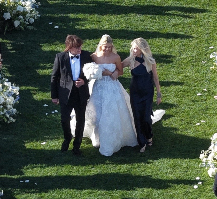 Richie Sambora and Heather Locklear walking their daughter Ava Locklear down the aisle at her wedding.