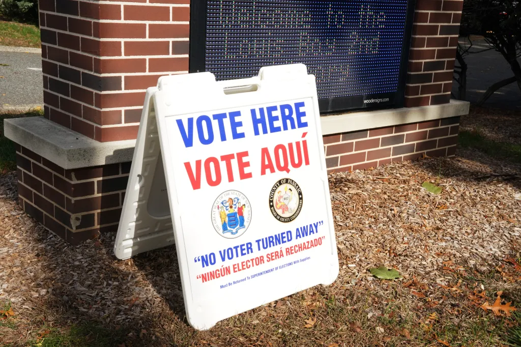 A "vote here" sign is displayed outside a voting location in Hawthorne, NJ, on Oct. 31, 2025. 