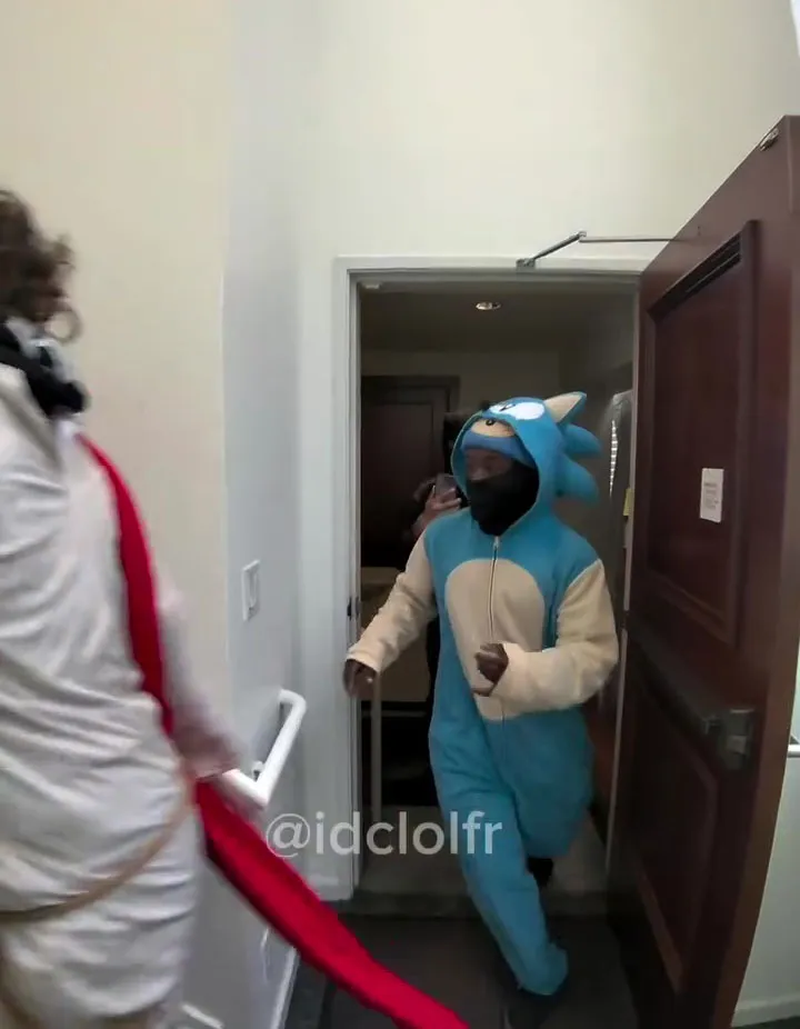 Person in Sonic the Hedgehog costume entering a building.