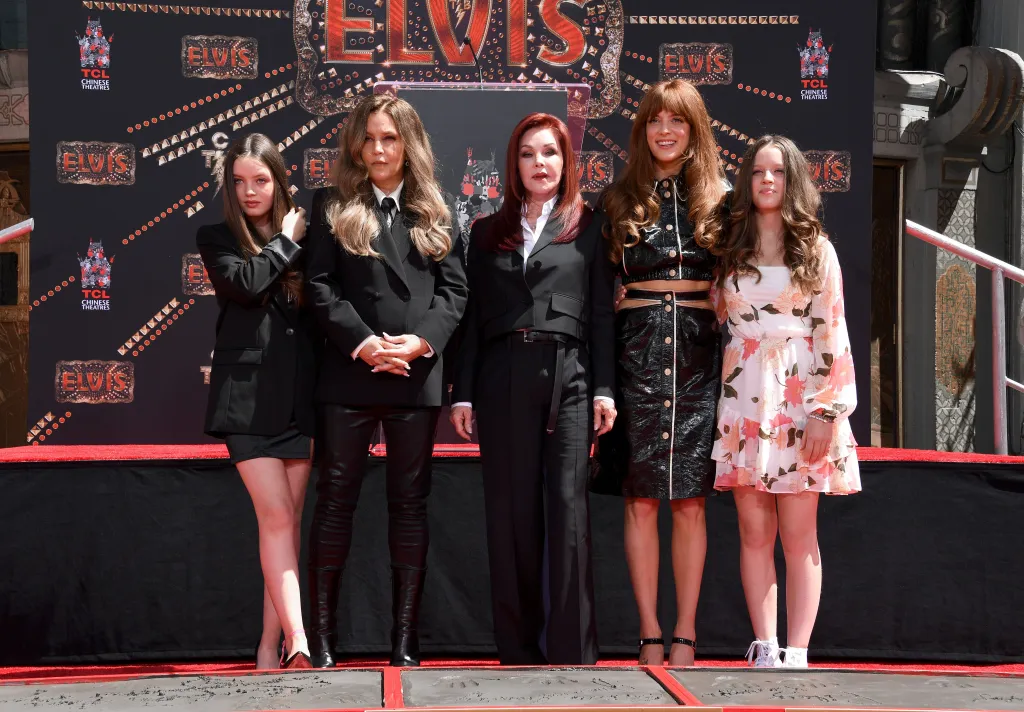 Harper Vivienne Ann Lockwood, Lisa Marie Presley, Priscilla Presley, Riley Keough, and Finley Aaron Love Lockwood attend a handprint ceremony.