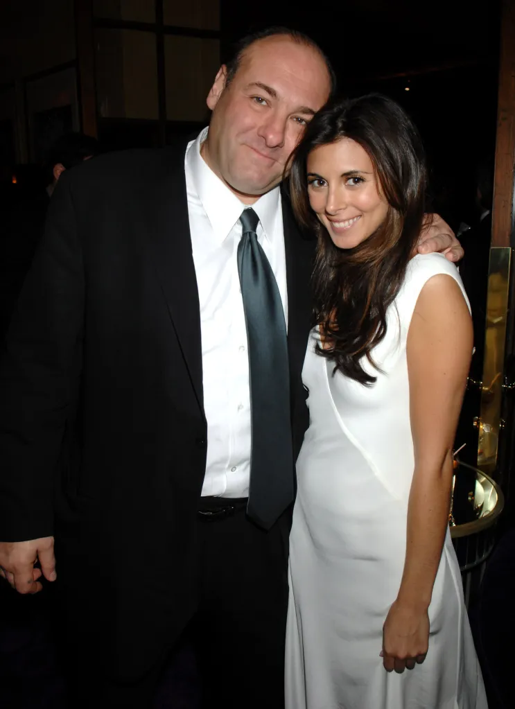 James Gandolfini and Jamie-Lynn Sigler smiling with their arms around each other.