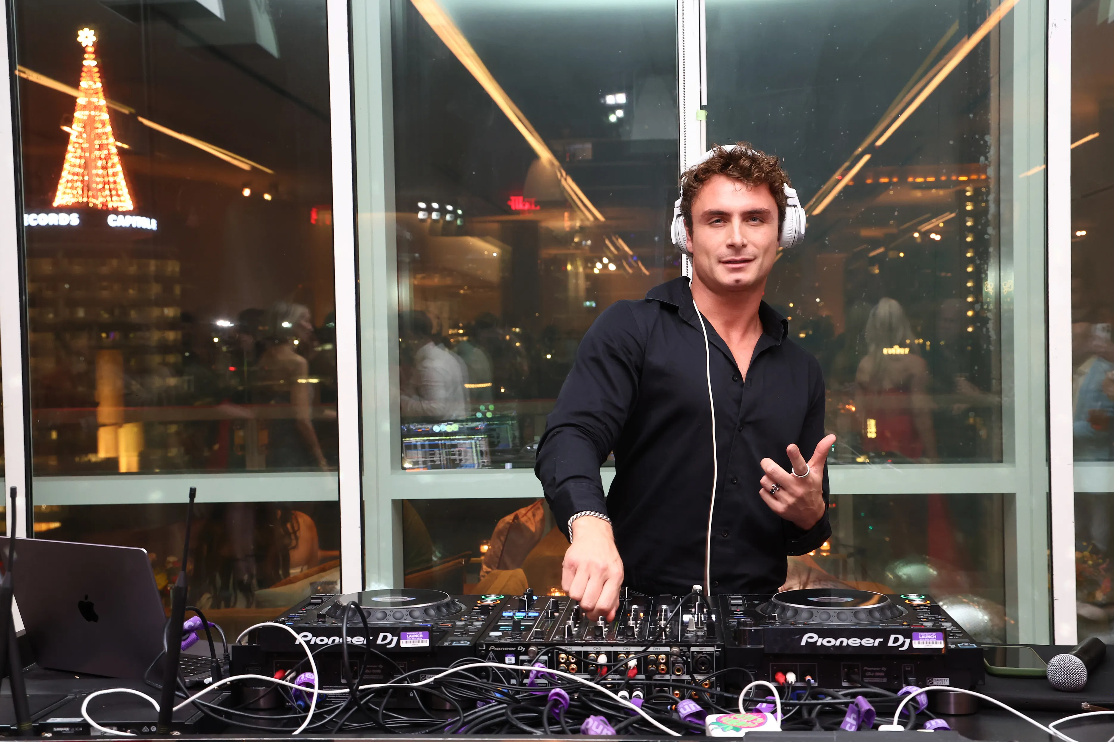 James Kennedy performs as a DJ at the Pups Without Borders 5 Year Anniversary Holiday Party.