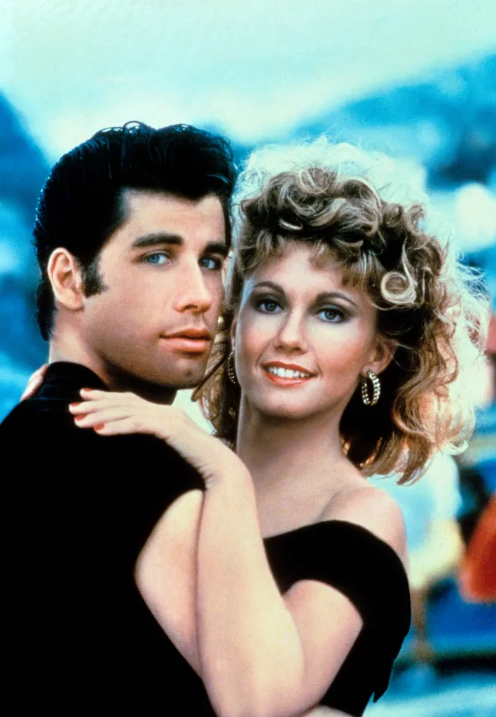 John Travolta and Olivia Newton-John as Danny and Sandy from the movie Grease.