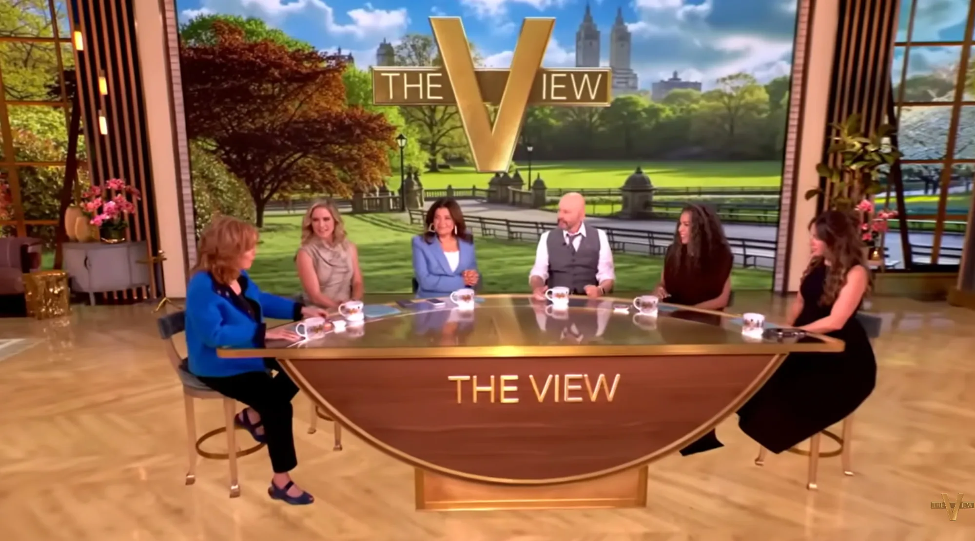 Jon Cryer on The View, with four female hosts, seated at a curved table with "THE VIEW" logo.