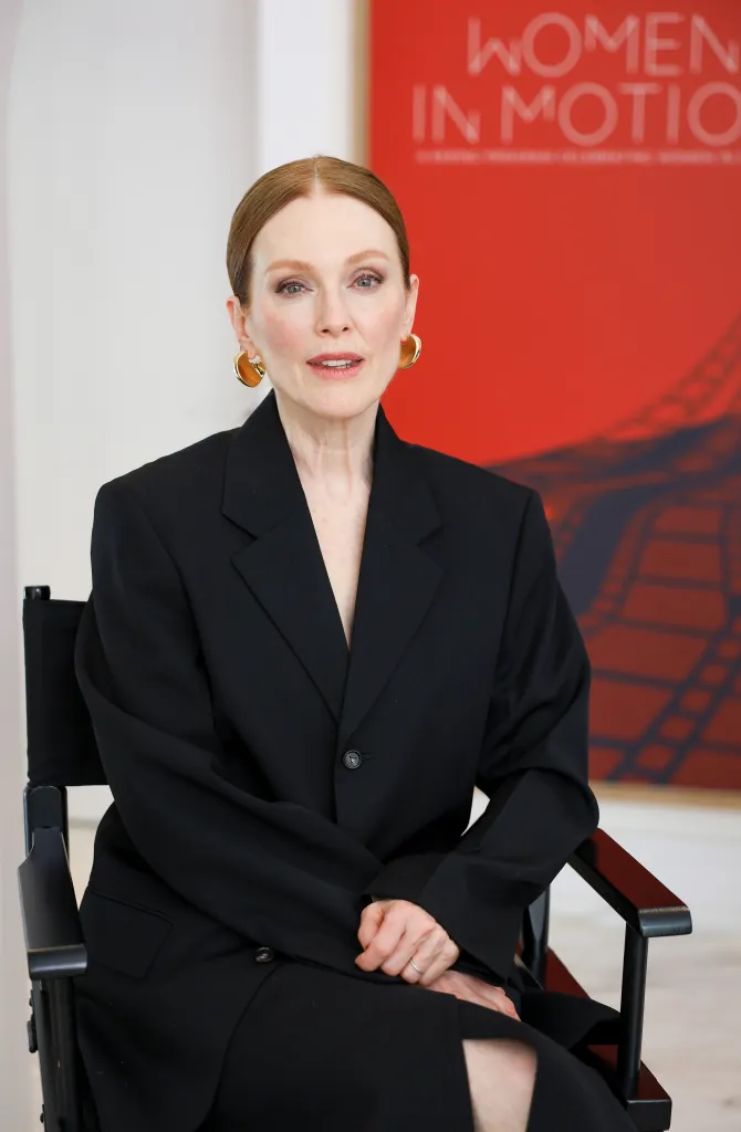 Julianne Moore sitting and facing forward at a "Women In Motion" talk.
