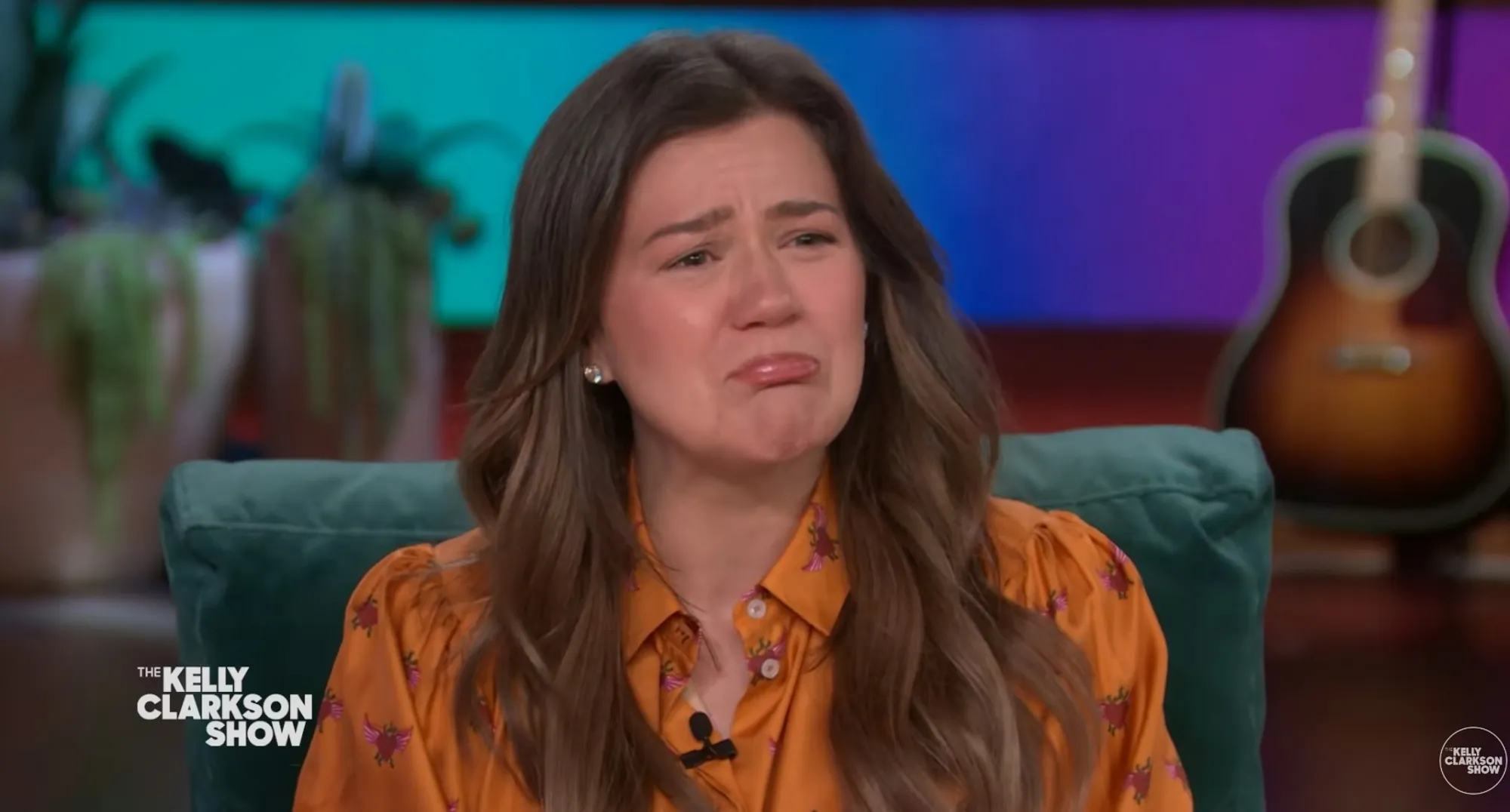 Kelly Clarkson crying in an interview on her talk show.