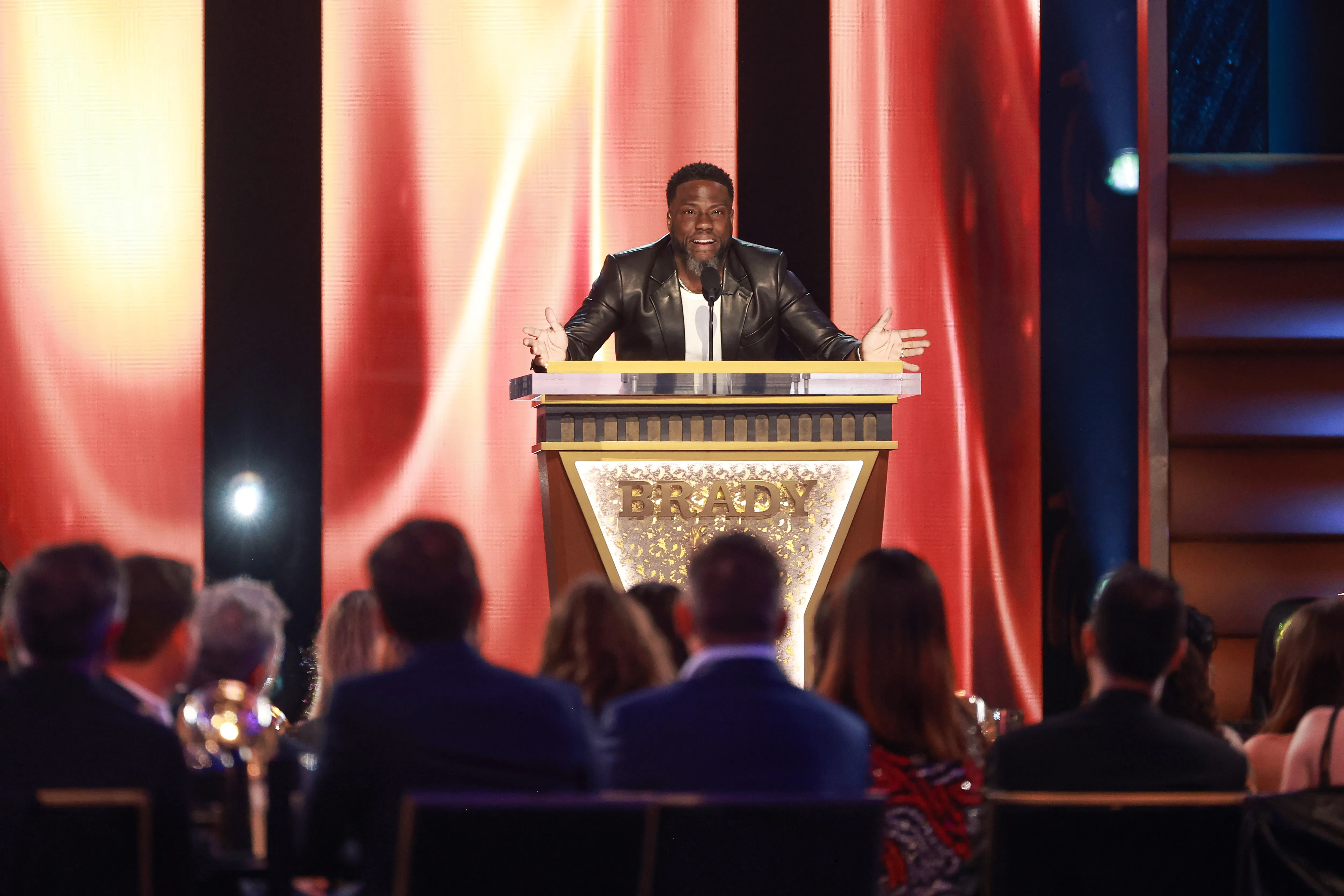 Kevin Hart speaking onstage at the G.R.O.A.T. The Greatest Roast Of All Time: Tom Brady for the Netflix is a Joke Festival.