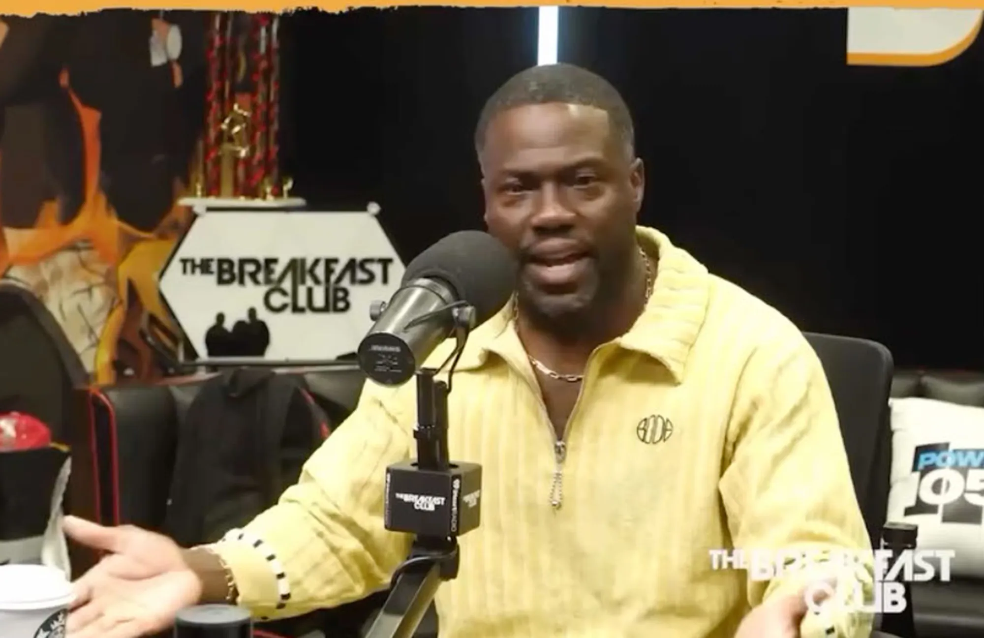 Kevin Hart speaking into a microphone on "The Breakfast Club."