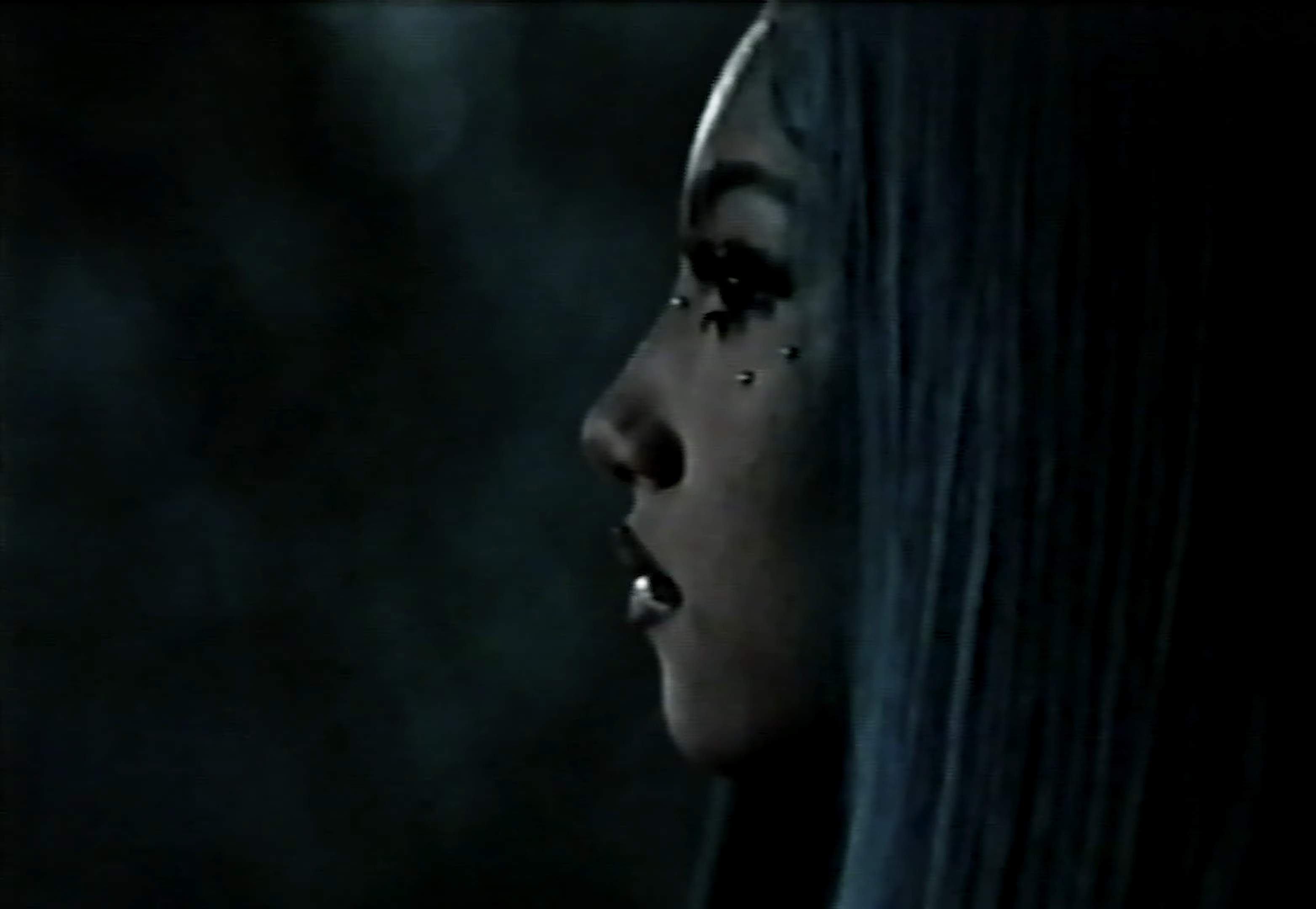 North West wearing faux under-eye piercings in a music video.