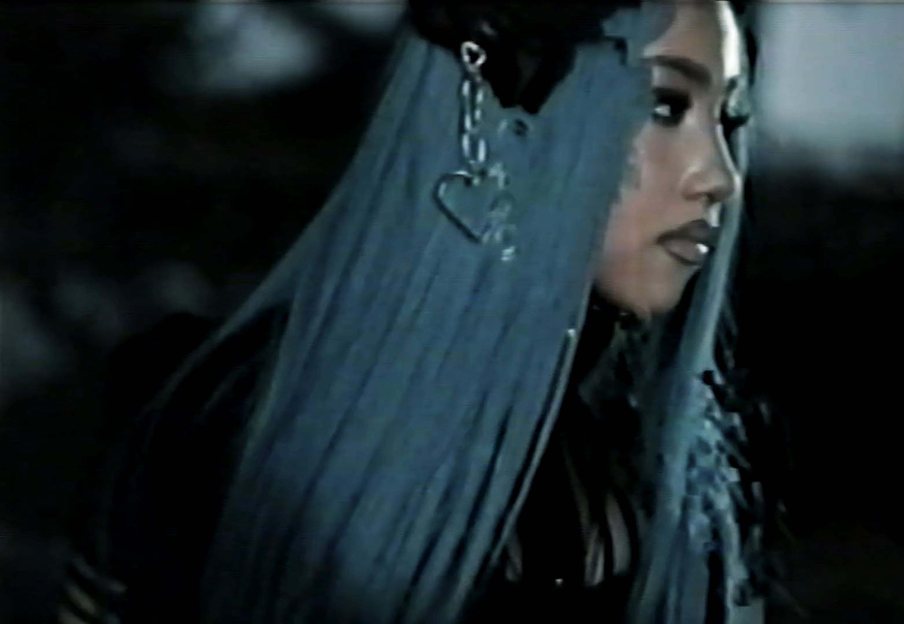 North West wearing a headband with a heart and chain accessory.