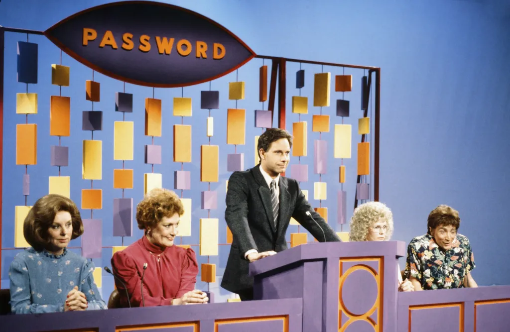 Christopher Guest as Bert Convy, Pamela Stephenson as Linda, and Martin Short as Robin Williams during the "Password" sketch on Saturday Night Live.