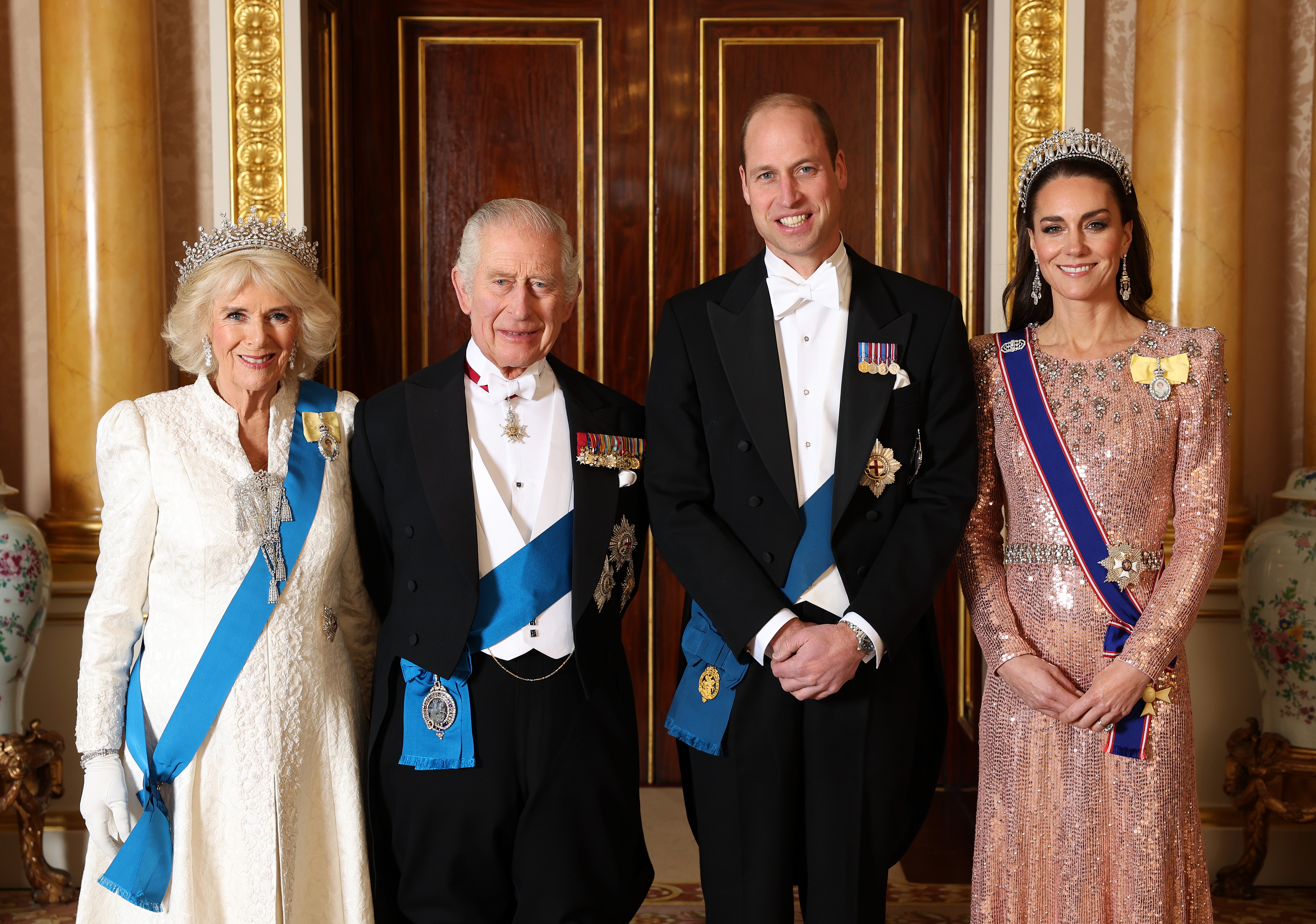 (L-R) Queen Camilla, King Charles III, Prince William, and Catherine, Princess of Wales pose for a photograph ahead of The Diplomatic Reception at Buckingham Palace.