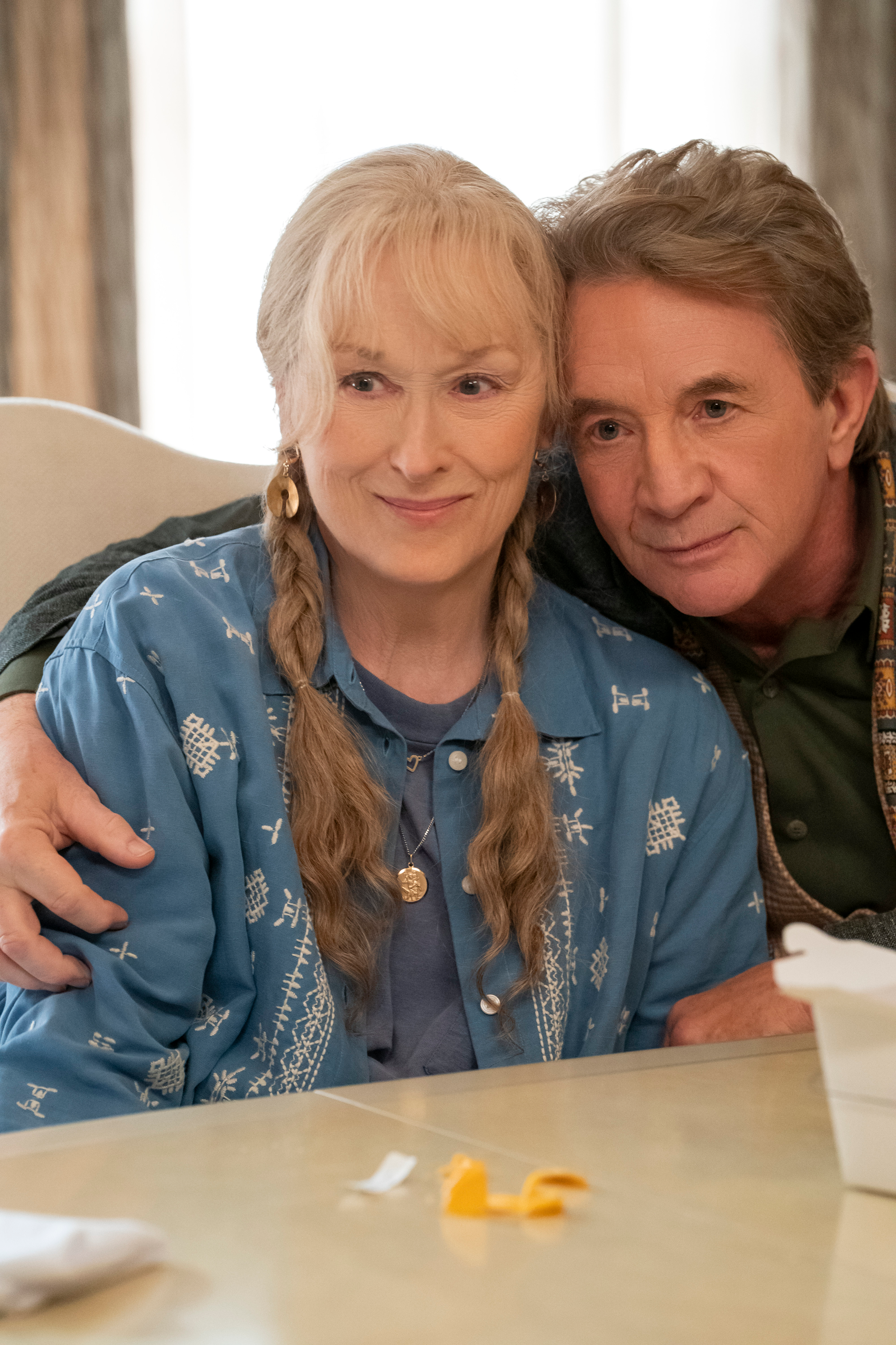 Meryl Streep and Martin Short from "Only Murders in the Building" embracing and smiling.