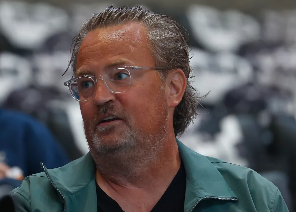 Matthew Perry attending a hockey game.