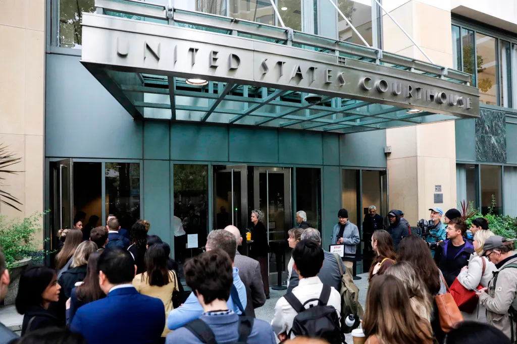 People gather outside the United States Courthouse in Oakland, California.