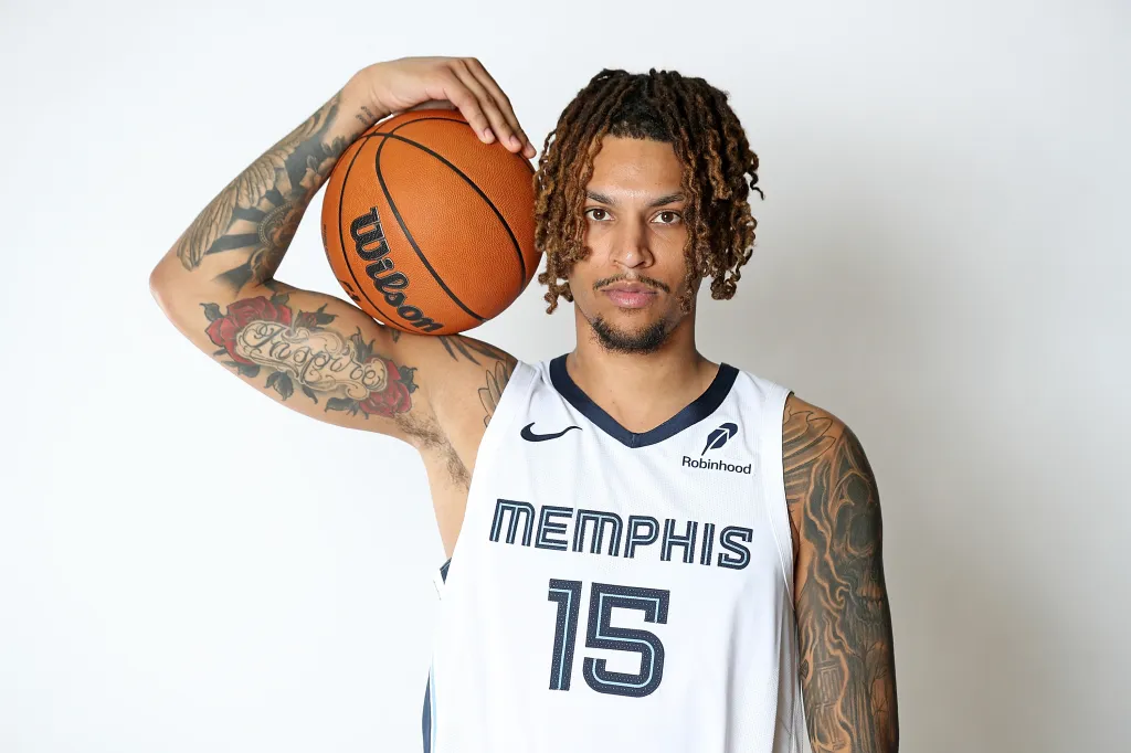 Memphis Grizzlies player Brandon Clarke holding a basketball.