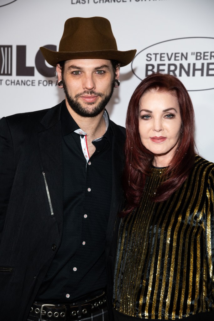 Musician Navarone Garcia and Priscilla Presley posing together.