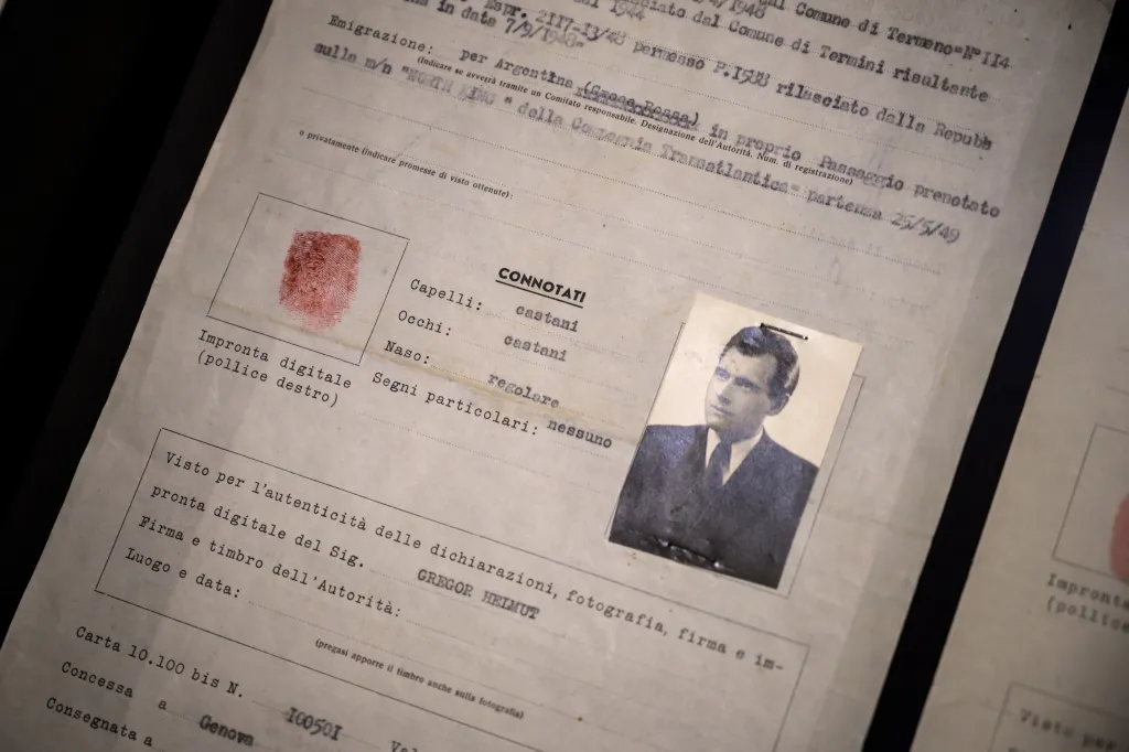 A 1949 passport issued to "Helmut Gregor," featuring a photograph and fingerprint, but used by Nazi war criminal Josef Mengele.