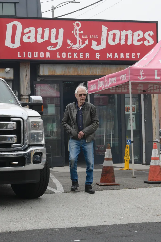 Paul Hogan seen near his home in Venice, CA, in front of "Davy Jones Liquor Locker & Market".