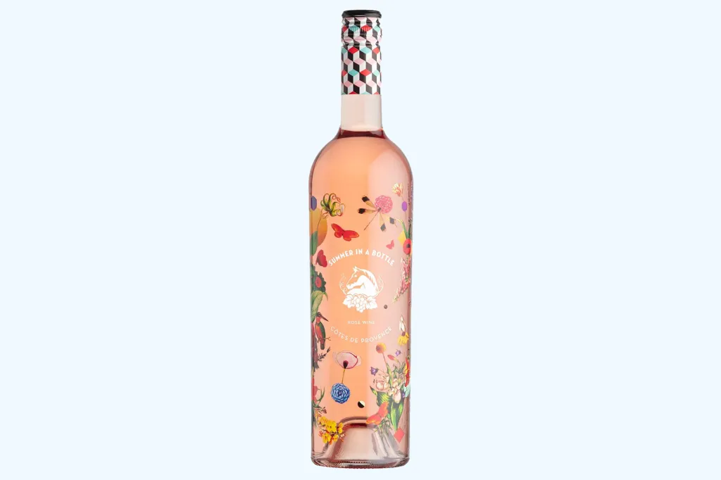 A bottle of Wolffer Estate Vineyard rosé wine with a floral illustration, labeled "Summer in a Bottle".
