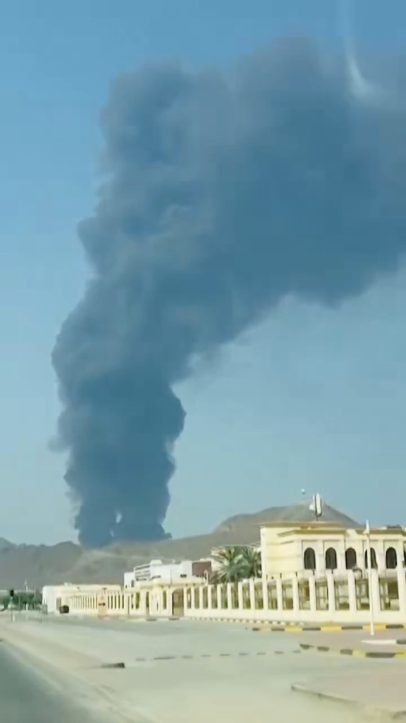 Thick black smoke rises from the Fujairah Oil Industry Zone.