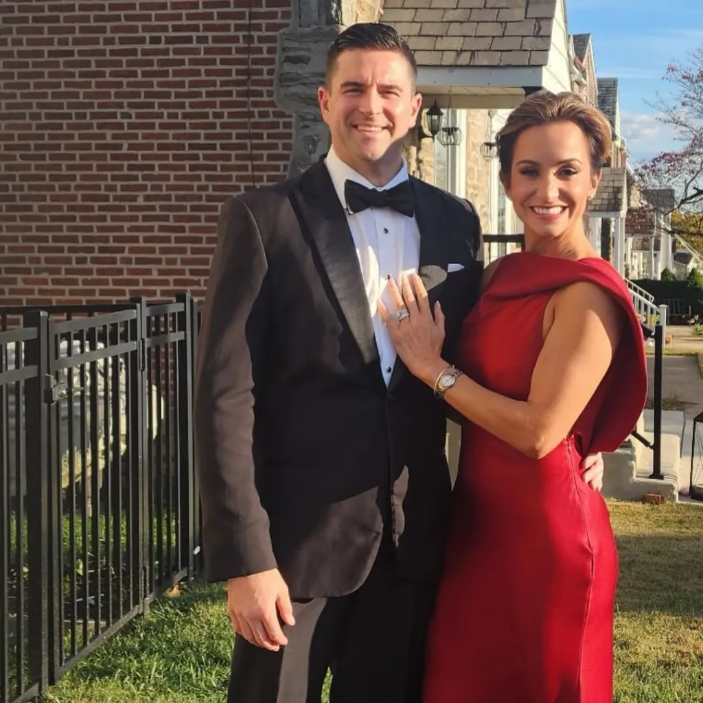 Dianna Russini and her husband, Kevin Goldschmidt, dressed in formal attire.