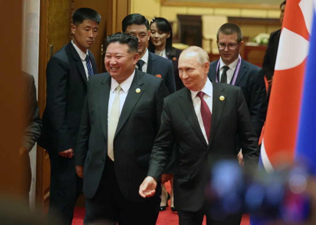 North Korea's Kim Jong Un smiling next to Russian President Vladimir Putin.