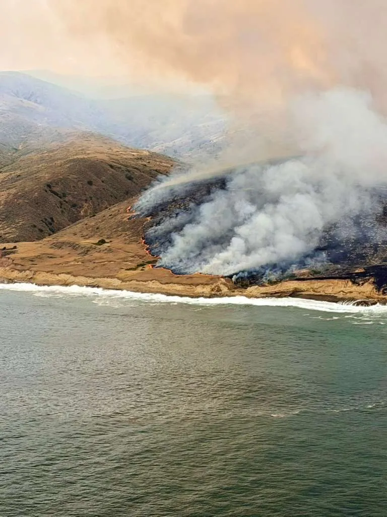 A large wildfire continues to spread across Santa Rosa Island, scorching more than 10,000 acres.