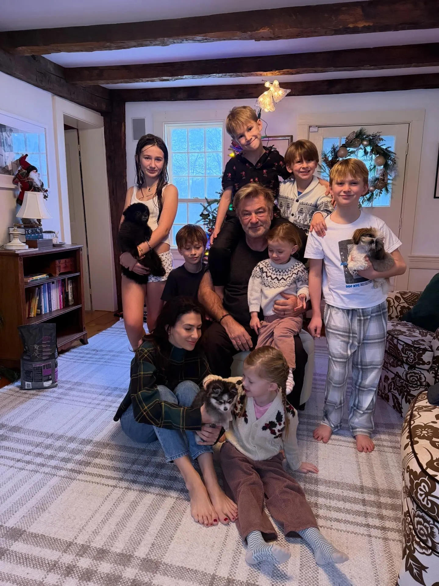 Hilaria Baldwin and Alec Baldwin with their seven children and three puppies during Christmas.