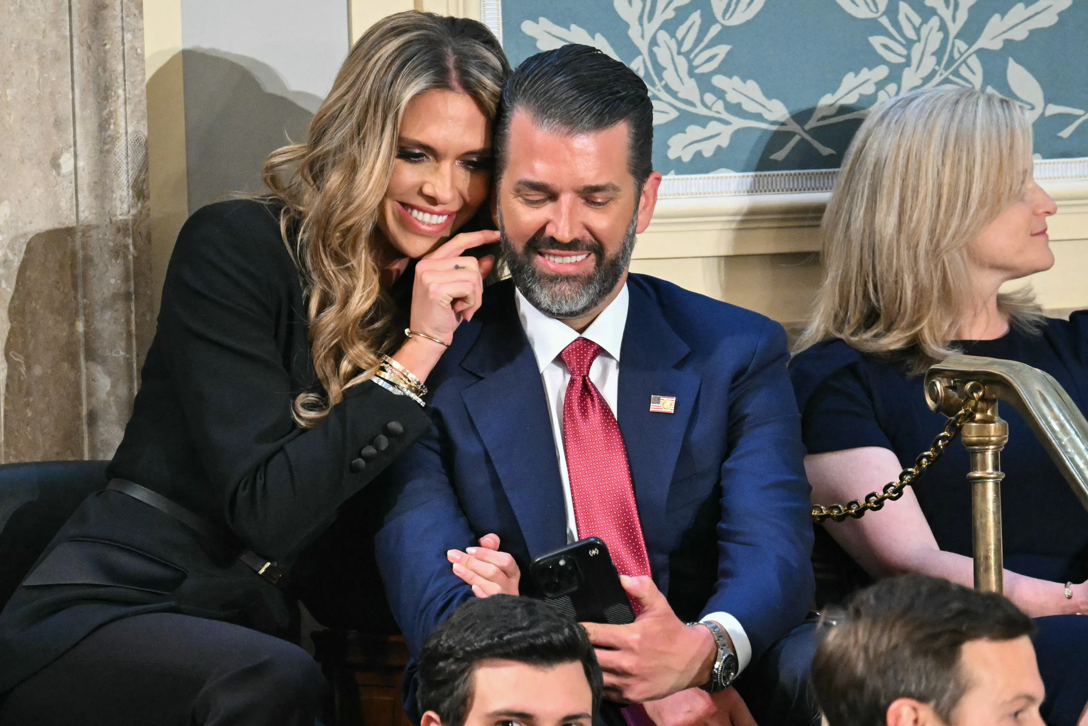 Bettina Anderson and Donald Trump Jr. seated in the House Chamber of the U.S. Capitol.