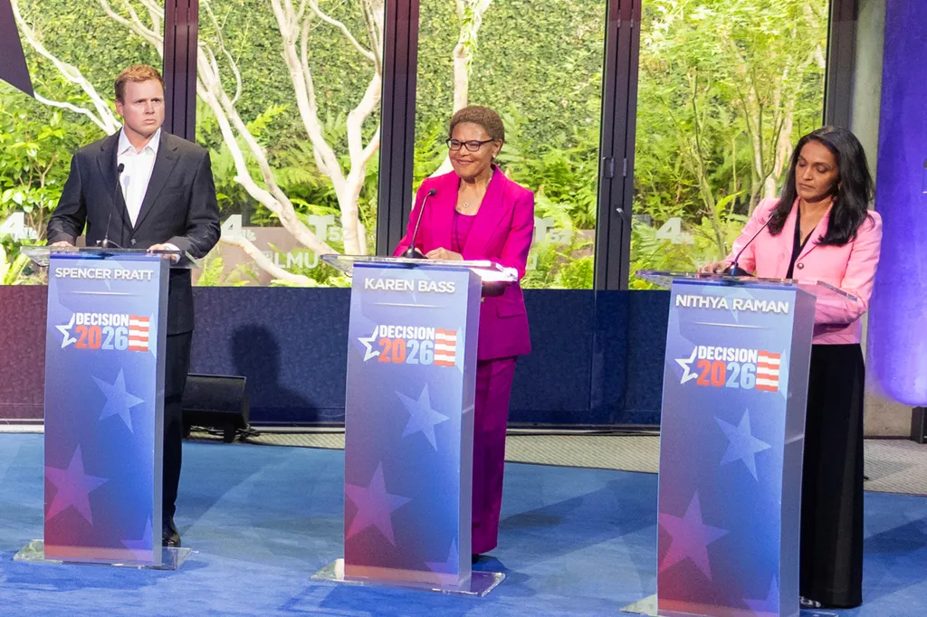 Spencer Pratt, Mayor Karen Bass, and Nithya Raman stand at podiums during the NBC4 and Telemundo 52 California Gubernatorial and Los Angeles Mayoral Debates.