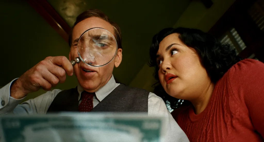 Spider-Noir looking through a magnifying glass at a document, with Peni Parker looking on.