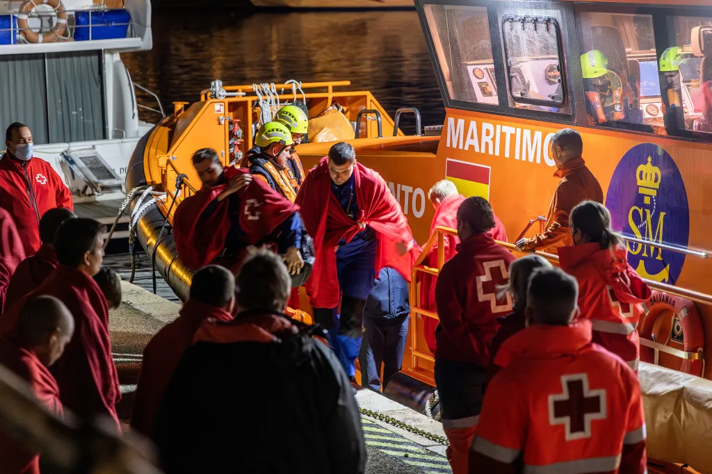Survivors of the Russian cargo ship Ursa Major sinking are helped off a Spanish Maritime Rescue boat.