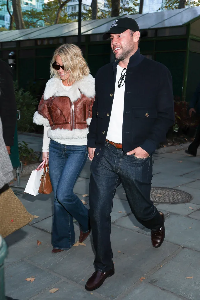 Sydney Sweeney and Scooter Braun walking together in Bryant Park.