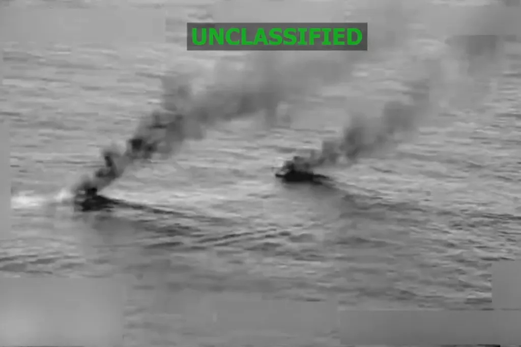 Two smoking vessels on the water with "UNCLASSIFIED" text in green at the top.