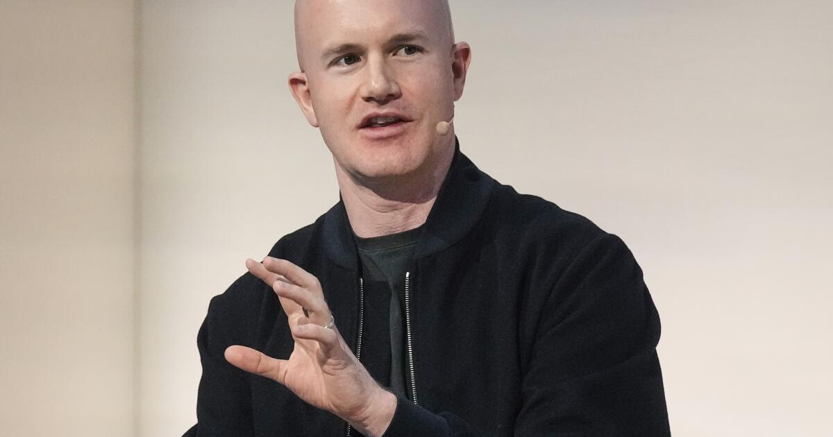 Crypto exchange Coinbase to lay off 14% of staff as AI reshapes work